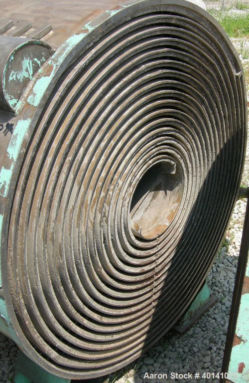Used American Heat Reclaiming Horizontal Spiral Heat Exchanger, type 1H, 1060 square feet, 316 stainless steel. Hot and cold side rated 100 psi at 200 deg F. Carbon steel removable heads, (1) with 31...