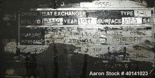 Used American Heat Reclaiming Horizontal Spiral Heat Exchanger, type 1H, 1060 square feet, 316 stainless steel. Hot and cold side rated 100 psi at 200 deg F. Carbon steel removable heads, (1) with 31...