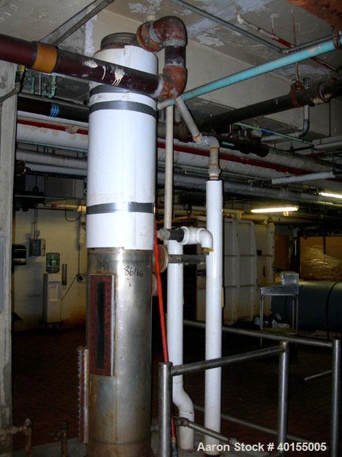 Used:  Roben single pass shell and tube heat exchanger, approximately 199 square feet, vertical. Carbon steel shell, stainless steel head with an 8" opening, (2) 2" nozzles for shell. Unit mounted on...