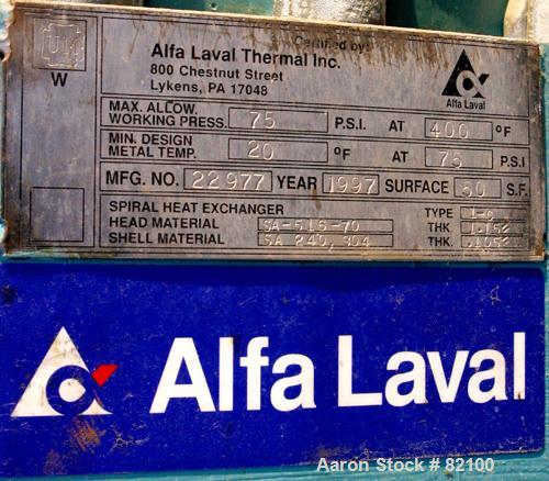 USED: Alfa Laval Spiral Heat Exchanger, 50 square feet, model 1-C, 304 stainless steel on product contact. Rated 75 psi at 400 deg F. Openings: hot side inlet/outlet 3"/2"; cold side inlet/outlet 2";...