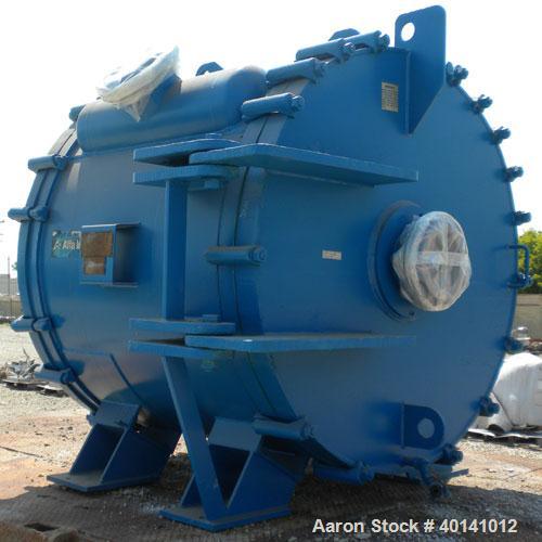Used Alfa Laval Thermal Horizontal Spiral Heat Exchanger, model 1H, 1400 square feet, 316L stainless steel product contact areas. Hot and cold side rated 150 psi at 250 deg F. Carbon steel removable ...