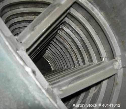 Used Alfa Laval Thermal Horizontal Spiral Heat Exchanger, model 1H, 1400 square feet, 316L stainless steel product contact areas. Hot and cold side rated 150 psi at 250 deg F. Carbon steel removable ...