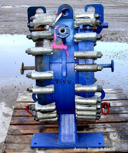 USED: Alfa Laval horizontal spiral heat exchanger, model 1-H, 172 square feet, 316 stainless steel product contact areas, carbon steel head. Rated 150 psi at 550 deg F, removable ends. Openings: hot ...