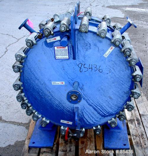 USED: Alfa Laval horizontal spiral heat exchanger, model 1-H, 172 square feet, 316 stainless steel product contact areas, carbon steel head. Rated 150 psi at 550 deg F, removable ends. Openings: hot ...