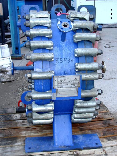 USED: Alfa Laval horizontal spiral heat exchanger, model 1-H, 172 square feet, 316 stainless steel product contact areas, carbon steel head. Rated 150 psi at 550 deg F, removable ends. Openings: hot ...