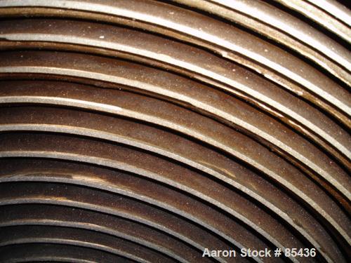 USED: Alfa Laval horizontal spiral heat exchanger, model 1-H, 172 square feet, 316 stainless steel product contact areas, carbon steel head. Rated 150 psi at 550 deg F, removable ends. Openings: hot ...