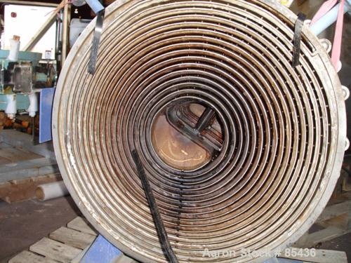 USED: Alfa Laval horizontal spiral heat exchanger, model 1-H, 172 square feet, 316 stainless steel product contact areas, carbon steel head. Rated 150 psi at 550 deg F, removable ends. Openings: hot ...
