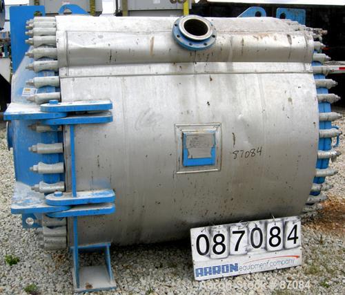 USED: Alfa Laval horizontal spiral heat exchanger, model 1H, 2200 square feet, 316/316L stainless steel product contact areas. Rated 100 psi/FV at 300 deg F. Hinged carbon steel removable heads. Open...