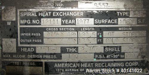 Used American Heat Reclaiming Horizontal Spiral Heat Exchanger, type 1H, 1060 square feet, 316L stainless steel product contact. Removable carbon steel heads with 316 stainless steel clad. Hot and co...