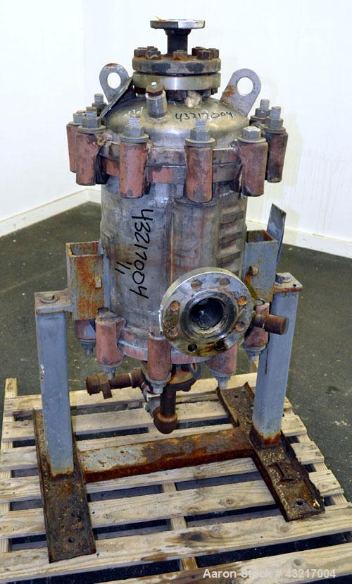 Used American Heat Reclaiming Vertical Spiral Heat Exchanger, Type 1-V, 30 Square Feet. 304 Stainless steel. Hot and cold side rated 75 psi at -20 to 1250 degrees F. Removable heads. Inner pass cross...
