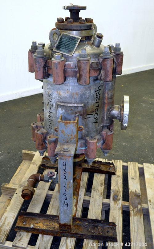 Used American Heat Reclaiming Vertical Spiral Heat Exchanger, Type 1-V, 30 Square Feet. 304 Stainless steel. Hot and cold side rated 75 psi at -20 to 1250 degrees F. Removable heads. Inner pass cross...