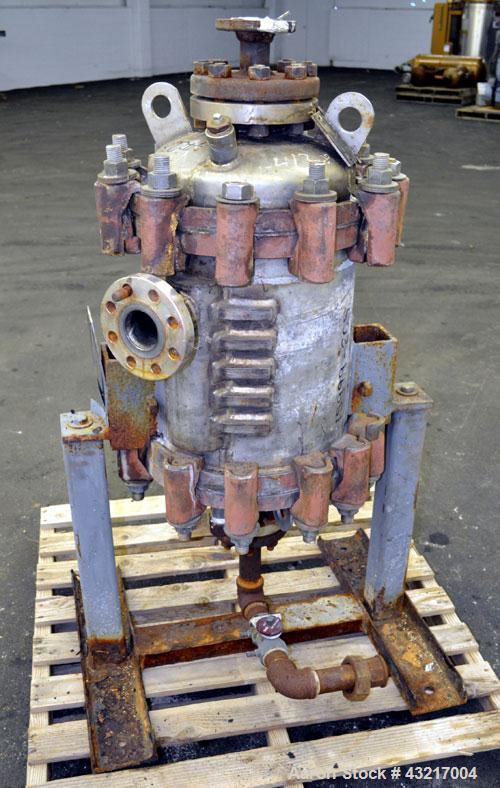 Used American Heat Reclaiming Vertical Spiral Heat Exchanger, Type 1-V, 30 Square Feet. 304 Stainless steel. Hot and cold side rated 75 psi at -20 to 1250 degrees F. Removable heads. Inner pass cross...