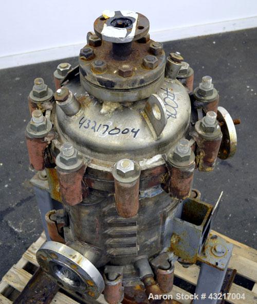 Used American Heat Reclaiming Vertical Spiral Heat Exchanger, Type 1-V, 30 Square Feet. 304 Stainless steel. Hot and cold side rated 75 psi at -20 to 1250 degrees F. Removable heads. Inner pass cross...