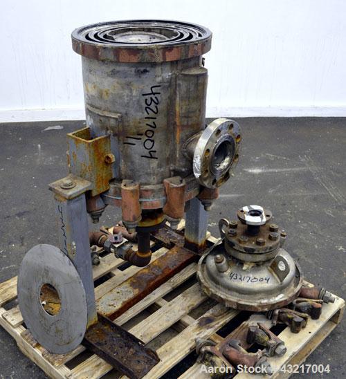 Used American Heat Reclaiming Vertical Spiral Heat Exchanger, Type 1-V, 30 Square Feet. 304 Stainless steel. Hot and cold side rated 75 psi at -20 to 1250 degrees F. Removable heads. Inner pass cross...