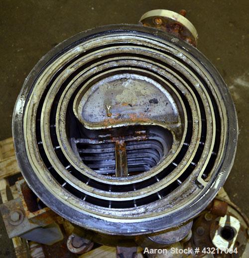 Used American Heat Reclaiming Vertical Spiral Heat Exchanger, Type 1-V, 30 Square Feet. 304 Stainless steel. Hot and cold side rated 75 psi at -20 to 1250 degrees F. Removable heads. Inner pass cross...