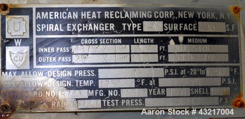 Used American Heat Reclaiming Vertical Spiral Heat Exchanger, Type 1-V, 30 Square Feet. 304 Stainless steel. Hot and cold side rated 75 psi at -20 to 1250 degrees F. Removable heads. Inner pass cross...
