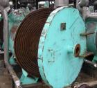 Used: American Heat Reclaim spiral heat exchanger, 1,690 square feet, type 1-H, carbon steel heads.  Internal: carbon steel, rated 100 psi @ 200 deg F/ -20 deg F @ 150 psi. Year 1977, serial #12105, ...