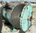 Used American Heat Reclaiming Horizontal Spiral Heat Exchanger, type 1H, 1060 square feet, 316 stainless steel. Hot and cold side rated 100 psi at 200 deg F. Carbon steel removable heads, (1) with 31...