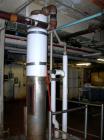Used:  Roben single pass shell and tube heat exchanger, approximately 199 square feet, vertical. Carbon steel shell, stainless steel head with an 8