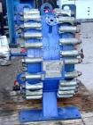 USED: Alfa Laval horizontal spiral heat exchanger, model 1-H, 172 square feet, 316 stainless steel product contact areas, carbon steel head. Rated 150 psi at 550 deg F, removable ends. Openings: hot ...