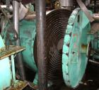 Used American Heat Reclaiming Horizontal Spiral Heat Exchanger, type 1H, 1060 square feet, 316L stainless steel product contact. Removable carbon steel heads with 316 stainless steel clad. Hot and co...