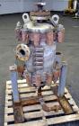 Used American Heat Reclaiming Vertical Spiral Heat Exchanger, Type 1-V, 30 Square Feet. 304 Stainless steel. Hot and cold side rated 75 psi at -20 to 1250 degrees F. Removable heads. Inner pass cross...