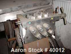 Used Gaulin Homogenizer, Model 1000MF18-5PS, Stainless Steel. Capacity 1000 gallons per hour. Missing homogenizing head assembly.  Driven by a 50 hp, 3/60/220/440 volt, 1765 rpm motor.