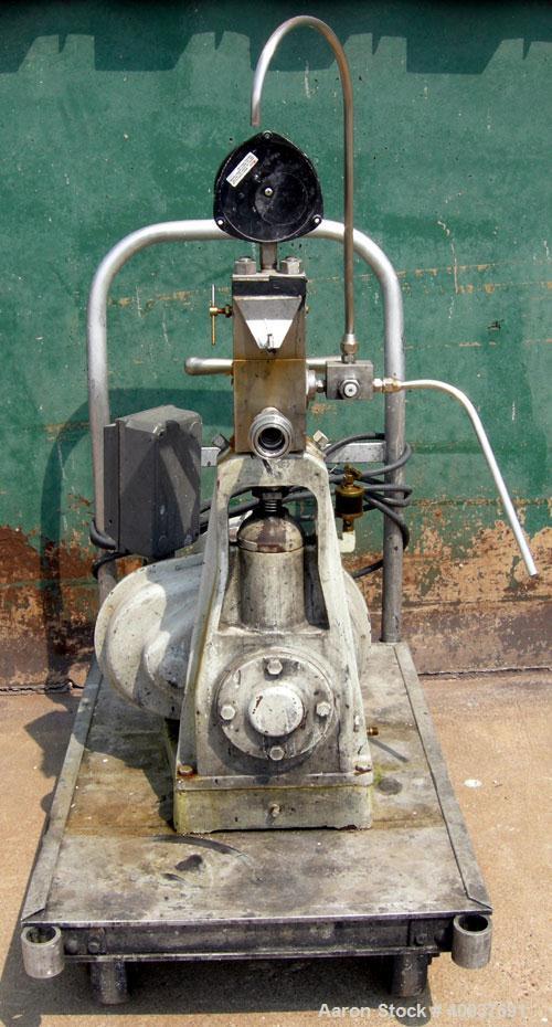 Used Gaulin Homogenizer, Model 31M3TA, 316 Stainless Steel. Approximately 31 gallons per hour, single stage valve, 3000 psi. Driven by a 3 hp, 3/60/230/460 volt, 1760 rpm motor. Mounted on a cart wit...