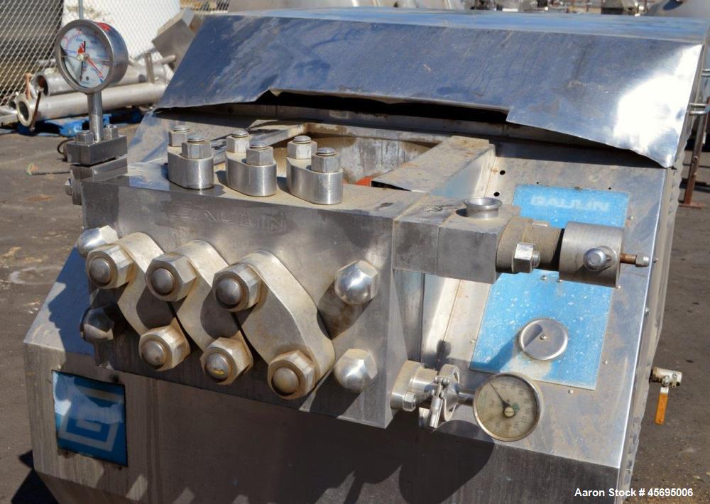 Used Gaulin Homogenizer, 304 Stainless Steel. Single stage valve assembly, 3 pistons. Driven by an approximate 50 hp motor (no tag). Head stamped with #s HT308029 & PT927857 OR. No manufactures tag w...