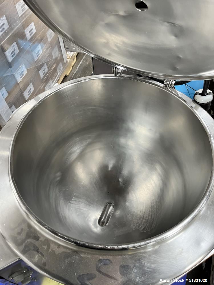 Used Groen electrically heated stainless steel kettle. approximately 50 gallons with top agitator drive.