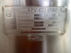 Used APV Crepaco Cooker / Kettle, Approximate 400 Gallon, Stainless Steel, Vertical. Flat top, coned bottom. Jacket rated 75 psi to -20 to 350 degrees F. Stainless steel agitator bridge. Center botto...