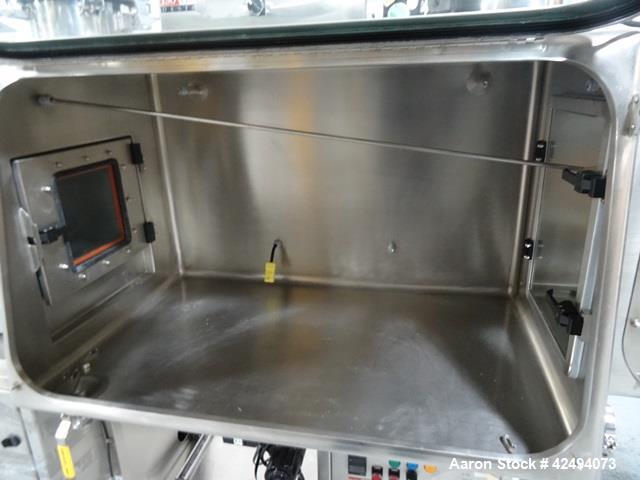 Used IsoTech Design Isolator, Model 150PROTECT. Stainless steel construction, 48" wide x 30" deep x 28" high chamber, single sided, (3) gloves, 20" x 20" x 24" long anti chamber with glove, end mount...
