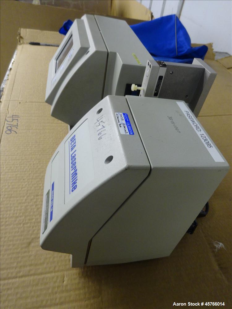 Used Beta Lasermike, Model # 283-10. Bench top laser non-contact measuring device. 130/230 VAC, .75 amp, 50/60Hz. Last calibrated on Jan. 2013. Serial # 38-01-1007.