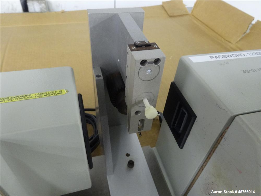 Used Beta Lasermike, Model # 283-10. Bench top laser non-contact measuring device. 130/230 VAC, .75 amp, 50/60Hz. Last calibrated on Jan. 2013. Serial # 38-01-1007.