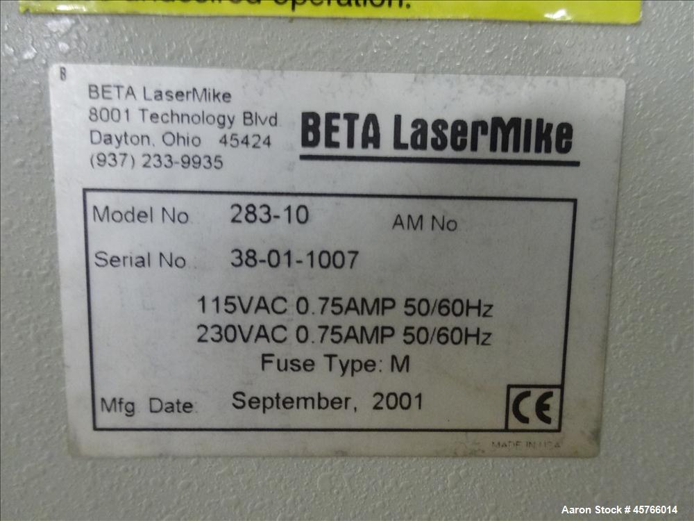 Used Beta Lasermike, Model # 283-10. Bench top laser non-contact measuring device. 130/230 VAC, .75 amp, 50/60Hz. Last calibrated on Jan. 2013. Serial # 38-01-1007.