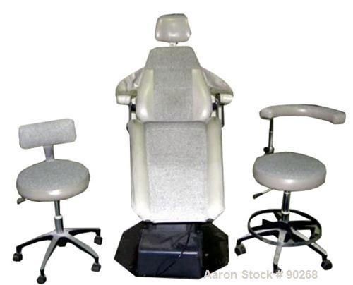 USED: A-Dec dental chair, model 1005. Foot pedal controls, wall mount delivery system with light and cuspidor. Includes doctor and assistant stools.