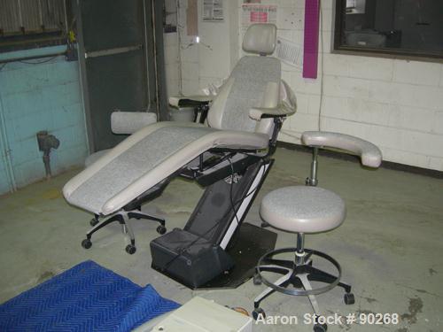 USED: A-Dec dental chair, model 1005. Foot pedal controls, wall mount delivery system with light and cuspidor. Includes doctor and assistant stools.