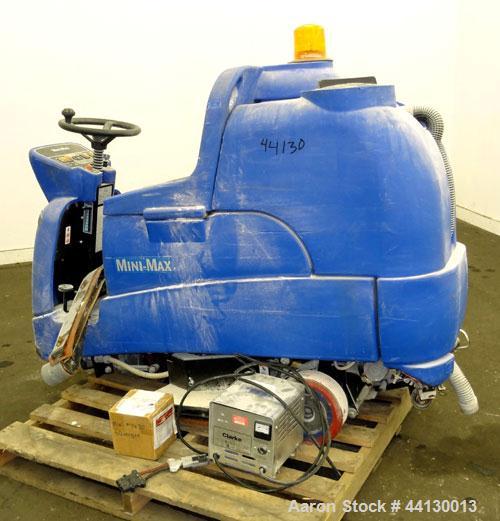 Used Clarke Alto Mini-Max Rider Floor Scrubber. Includes a battery charger, no batteries. Built 2002.