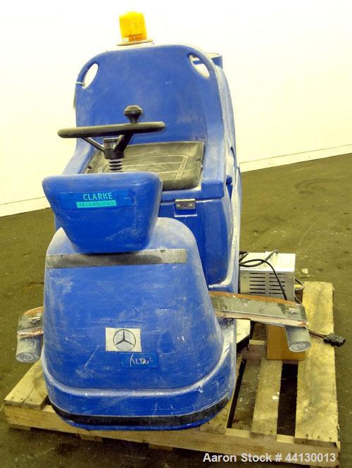 Used Clarke Alto Mini-Max Rider Floor Scrubber. Includes a battery charger, no batteries. Built 2002.