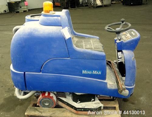 Used Clarke Alto Mini-Max Rider Floor Scrubber. Includes a battery charger, no batteries. Built 2002.