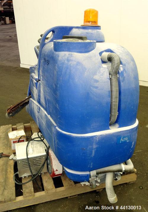 Used Clarke Alto Mini-Max Rider Floor Scrubber. Includes a battery charger, no batteries. Built 2002.
