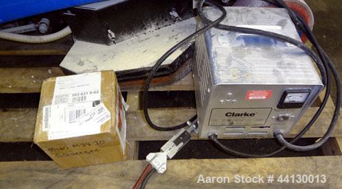 Used Clarke Alto Mini-Max Rider Floor Scrubber. Includes a battery charger, no batteries. Built 2002.