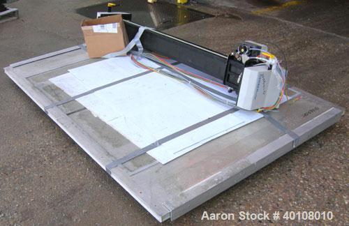 Used: Gerber cutting edge digital cutting system, model  DCS2500. Designed as a table top size plotter/cutter. Includes a model DCS2500 carriage assembly,65" wide x 96" long reverse air hold down tab...