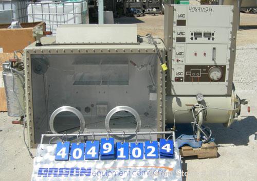 Used Vacuum Atmosphere Company glove box, model HE-493/MO-5. 50/60 hz, 110 volt, 5 amp. Rated plus 10 psig. Includes a model AMO-2032 moisture/ oxygen analyzer, AO- calibration panel, and a model PC-...