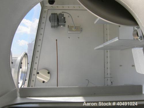 Used Vacuum Atmosphere Company glove box, model HE-493/MO-5. 50/60 hz, 110 volt, 5 amp. Rated plus 10 psig. Includes a model AMO-2032 moisture/ oxygen analyzer, AO- calibration panel, and a model PC-...