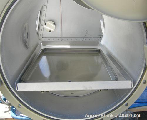 Used Vacuum Atmosphere Company glove box, model HE-493/MO-5. 50/60 hz, 110 volt, 5 amp. Rated plus 10 psig. Includes a model AMO-2032 moisture/ oxygen analyzer, AO- calibration panel, and a model PC-...
