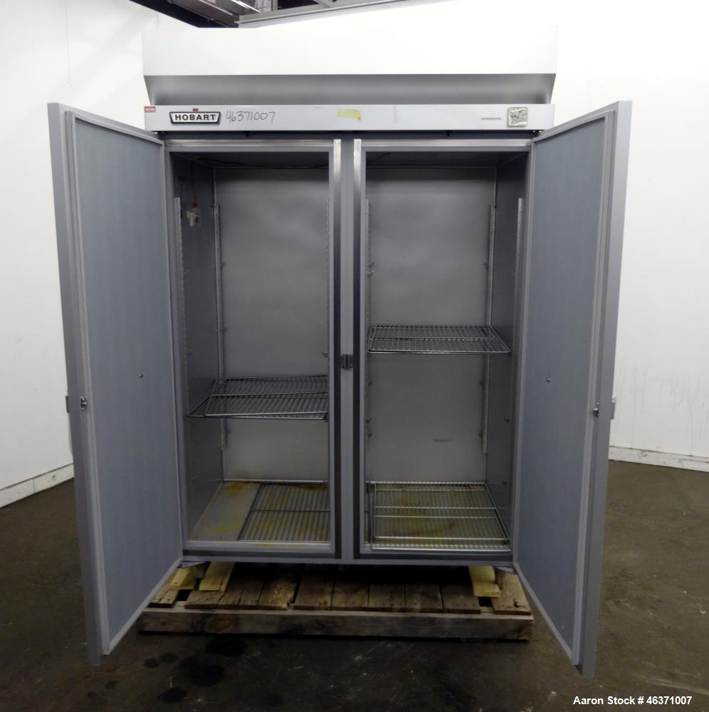 Used Hobart Two Section Medium Temperature Refrigerator, Model Q2. 48.9 Cubic feet capacity, approximate interior dimension 50-1/2" wide x 59" tall x 28" deep. 1/60/120 volt, 11.2 amp. 8 Ounce charge...