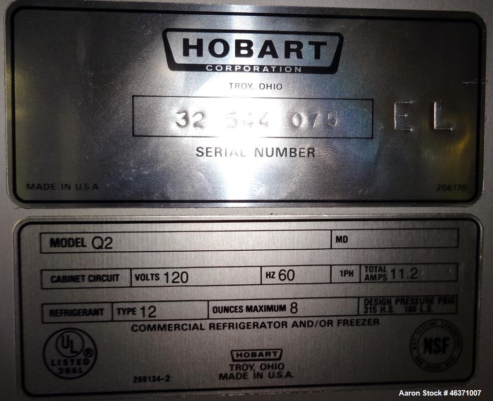 Used Hobart Two Section Medium Temperature Refrigerator, Model Q2. 48.9 Cubic feet capacity, approximate interior dimension 50-1/2" wide x 59" tall x 28" deep. 1/60/120 volt, 11.2 amp. 8 Ounce charge...