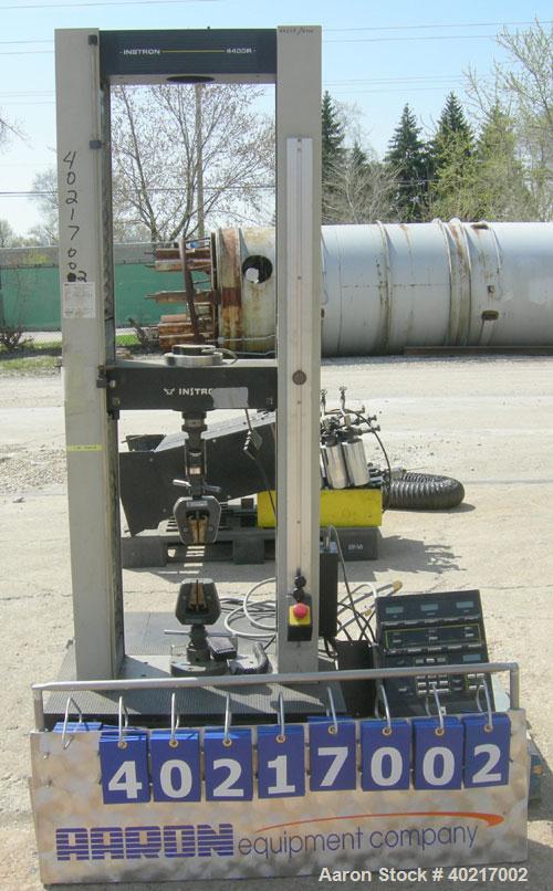 Used Instron tensile tester, model 1122.  Designed and used for testing the physical properties and stretching capabilities of plastics.  Rated 5 KN.  Manually operated clamps. Includes model 4400 di...