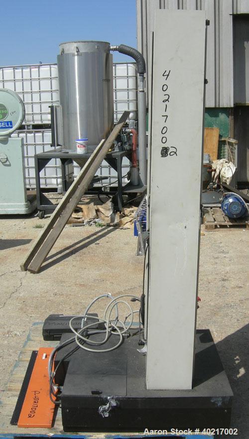 Used Instron tensile tester, model 1122.  Designed and used for testing the physical properties and stretching capabilities of plastics.  Rated 5 KN.  Manually operated clamps. Includes model 4400 di...